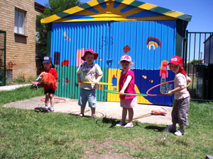 Hoola Hooping in front of the shed
